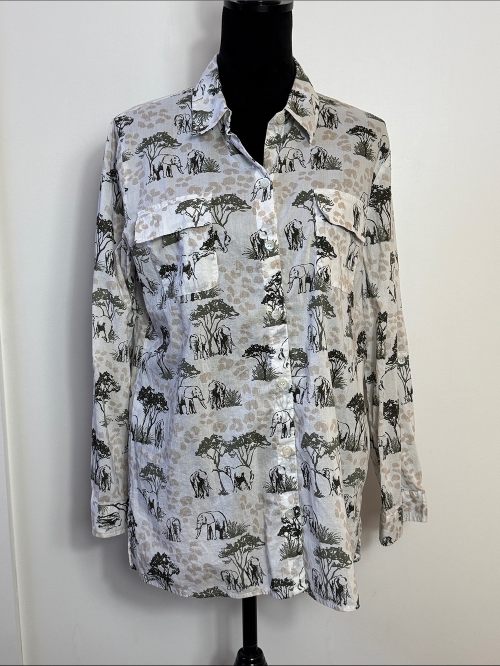Chicos Lady’s Elephant Print Button-Up blouse.